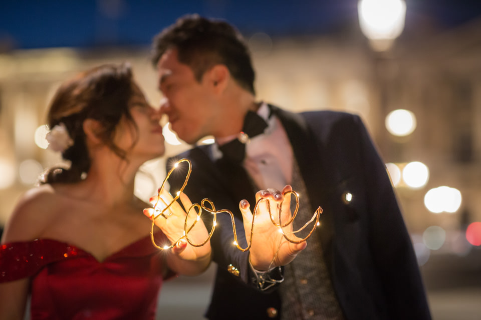 Couple holding lights with love