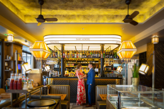 couple posing in a cafe in Paris