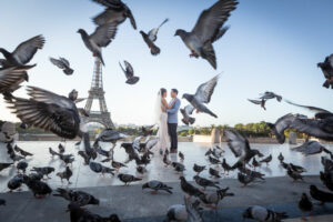 Couple kissing the Trocadero with the Eiffel Tower in the back