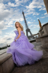 woman posing in blue dress on the Trocadero in Paris